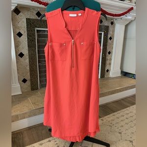 Women’s zip front coral dress.